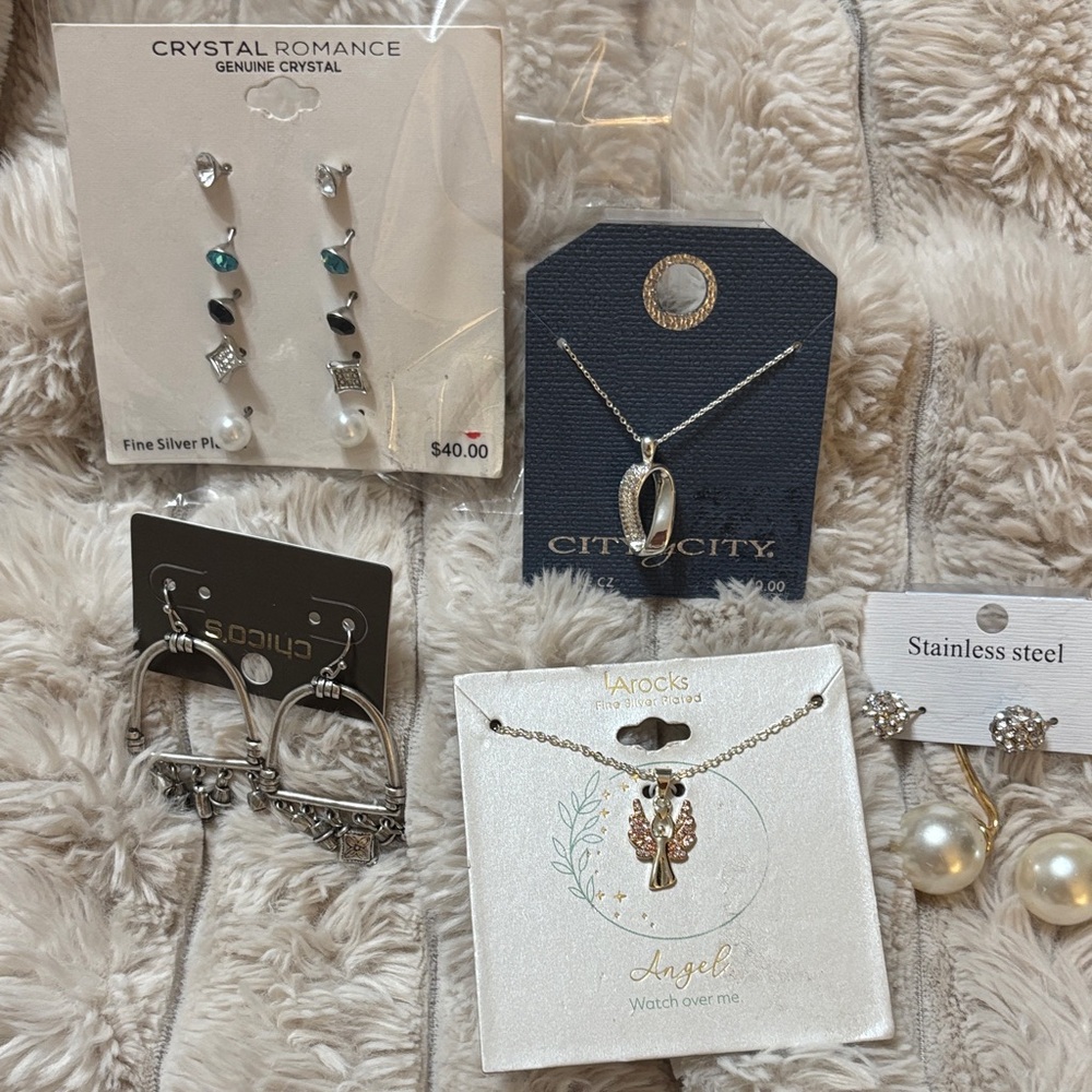 Silver Earrings and necklaces each pair is over $40. This is for all five.